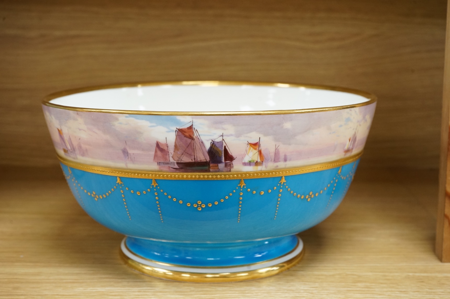 A 19th century Mintons bowl hand-painted by W J Dean, with boats to the top rim, 25cm in diameter